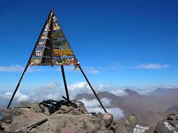 Metal summit pyramid in blue sky