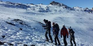 Group of hikers walking in snow
