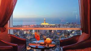 Tables on a terrace with view of Hassan II Mosque