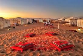 Tent lodge set in golden Sahara sand