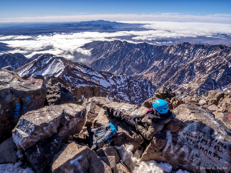 Snowy ridges and deep valleys from a summit