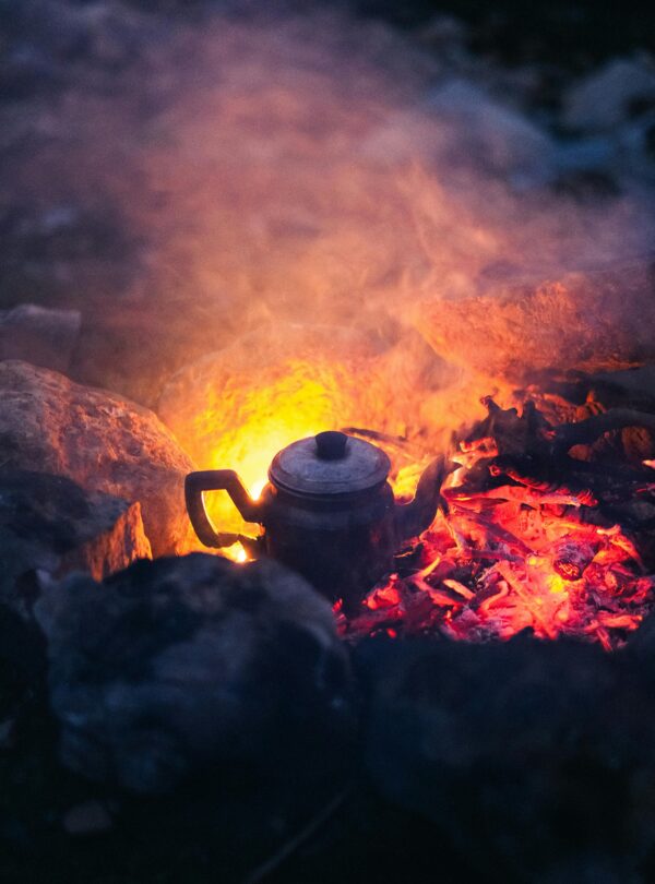 Tea kettle over open desert fire