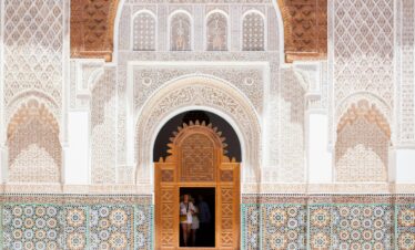 Blue doorway with potted plants and tiled steps