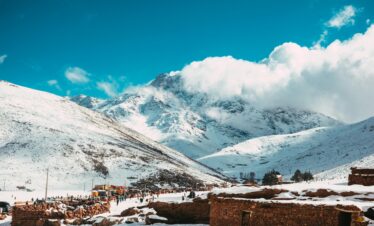 Traditional Moroccan carpet display in an indoor setting.