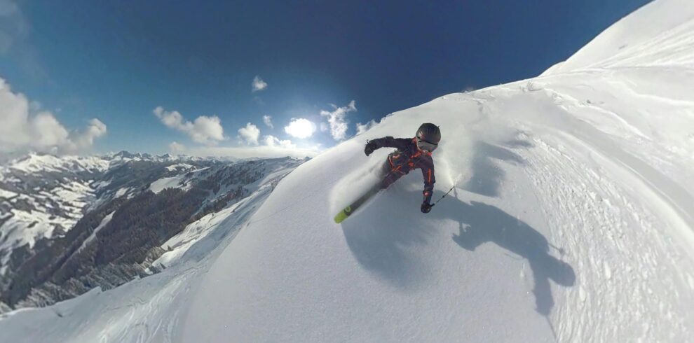 Snowboarder going downhill on snow