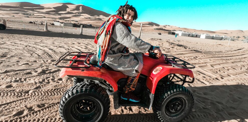 Man riding an ATV in the desert