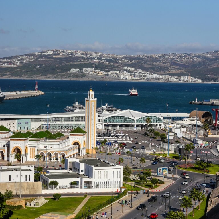 Large mosque with a tall minaret by the sea
