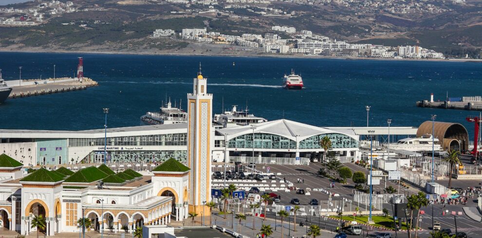 Large mosque with a tall minaret by the sea