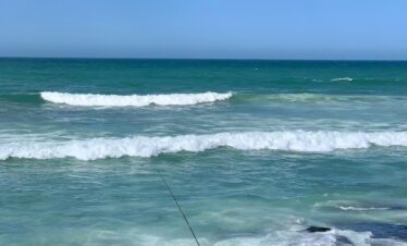 View of ocean waves crashing onto the shore