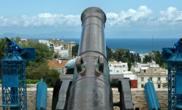 Old war cannon facing the sea