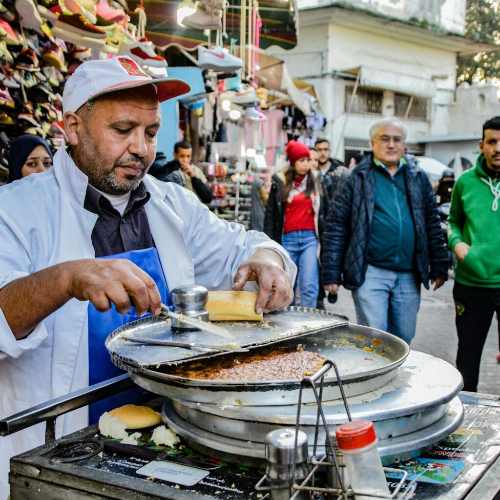 Vendor preparing traditional Moroccan food