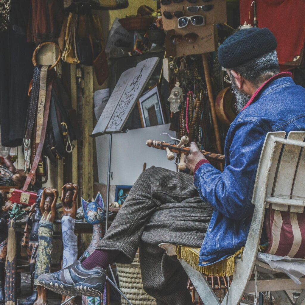 Man crafting goods in a traditional market