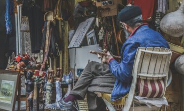 Man crafting goods in a traditional market