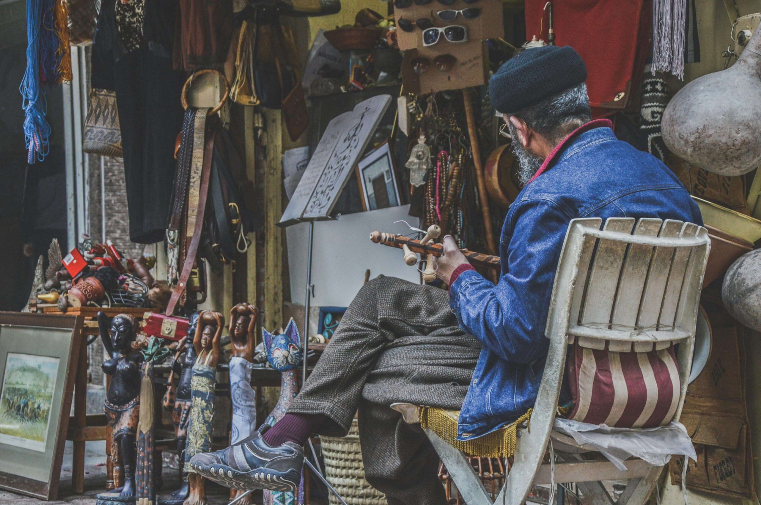 Man crafting goods in a traditional market