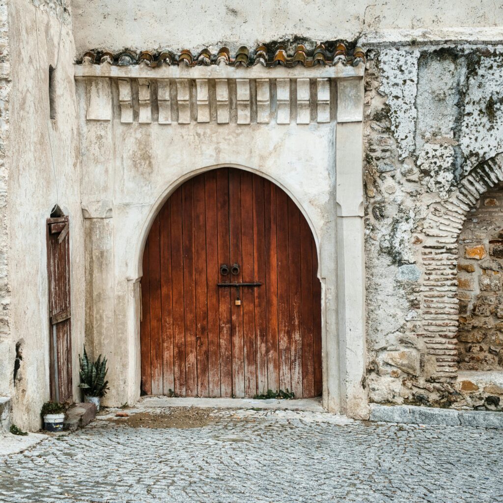 Rustic wooden door set in a stone wall