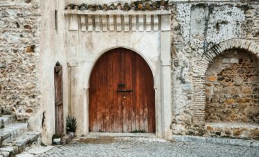 Rustic wooden door set in a stone wall