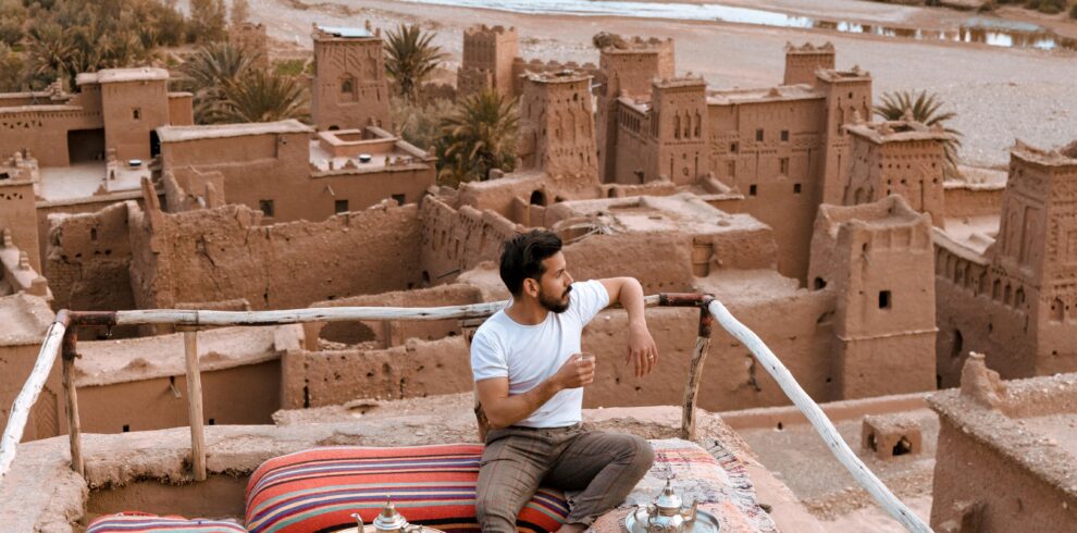 Man drinking tea on rooftop terrace