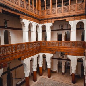 a large building with a clock on the wall Fez City