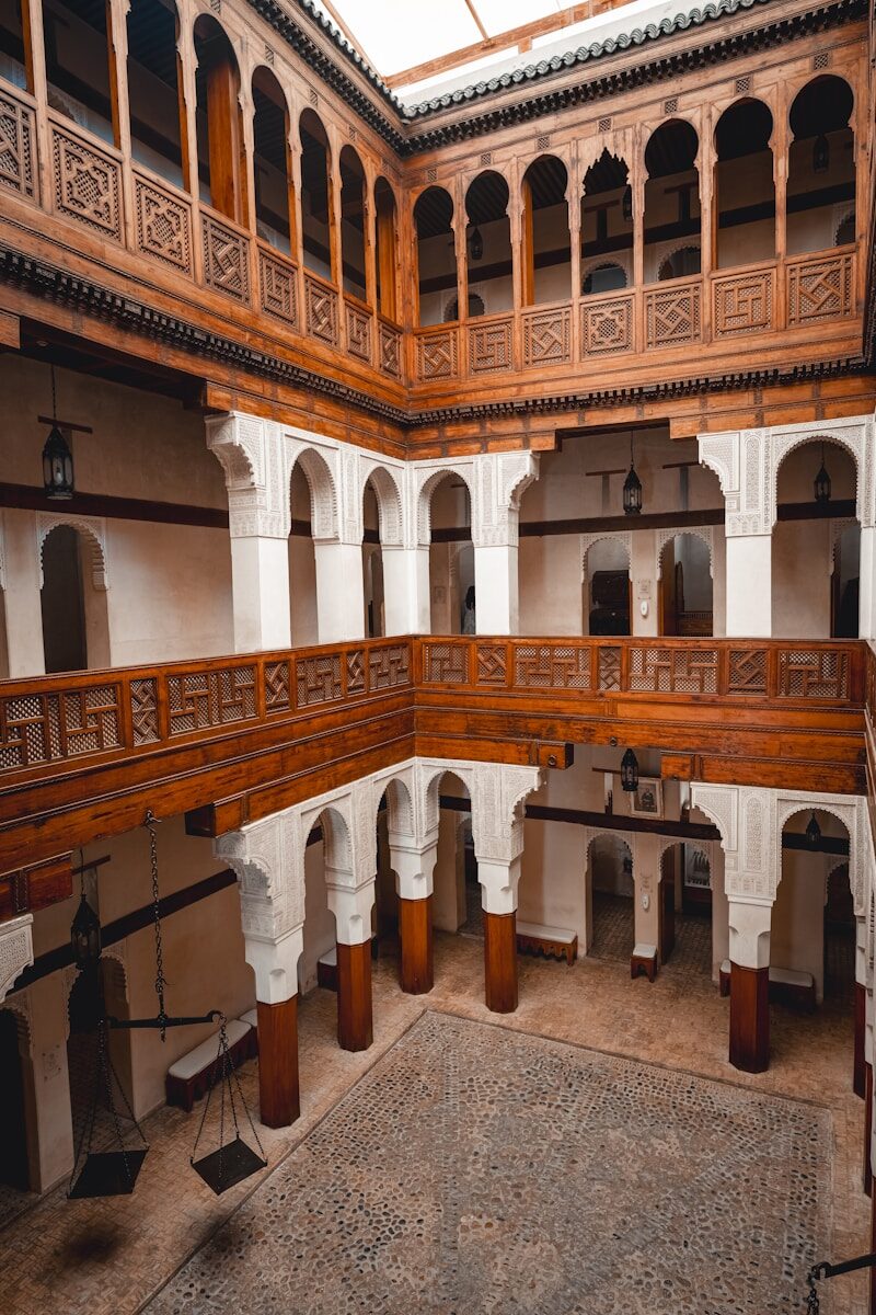 a large building with a clock on the wall Fez City
