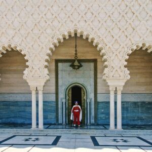 a person standing in a doorway of a building Rabat City