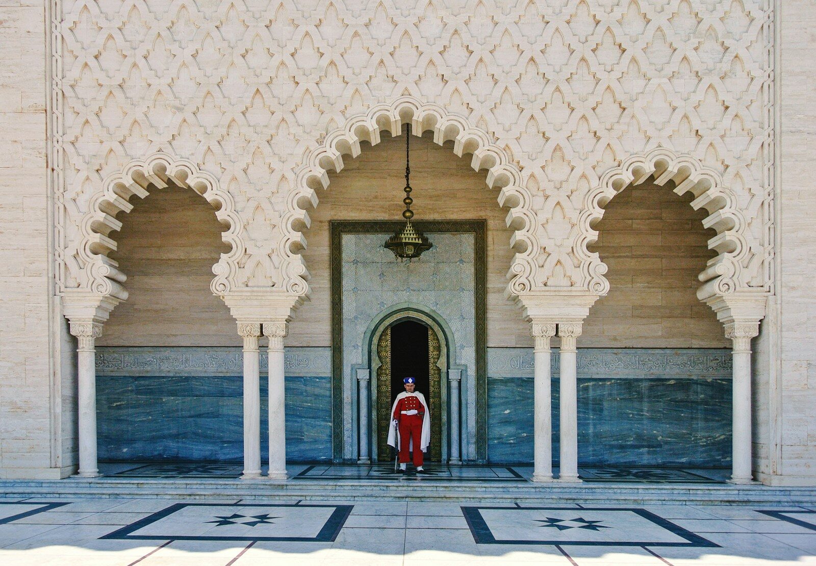 a person standing in a doorway of a building Rabat City