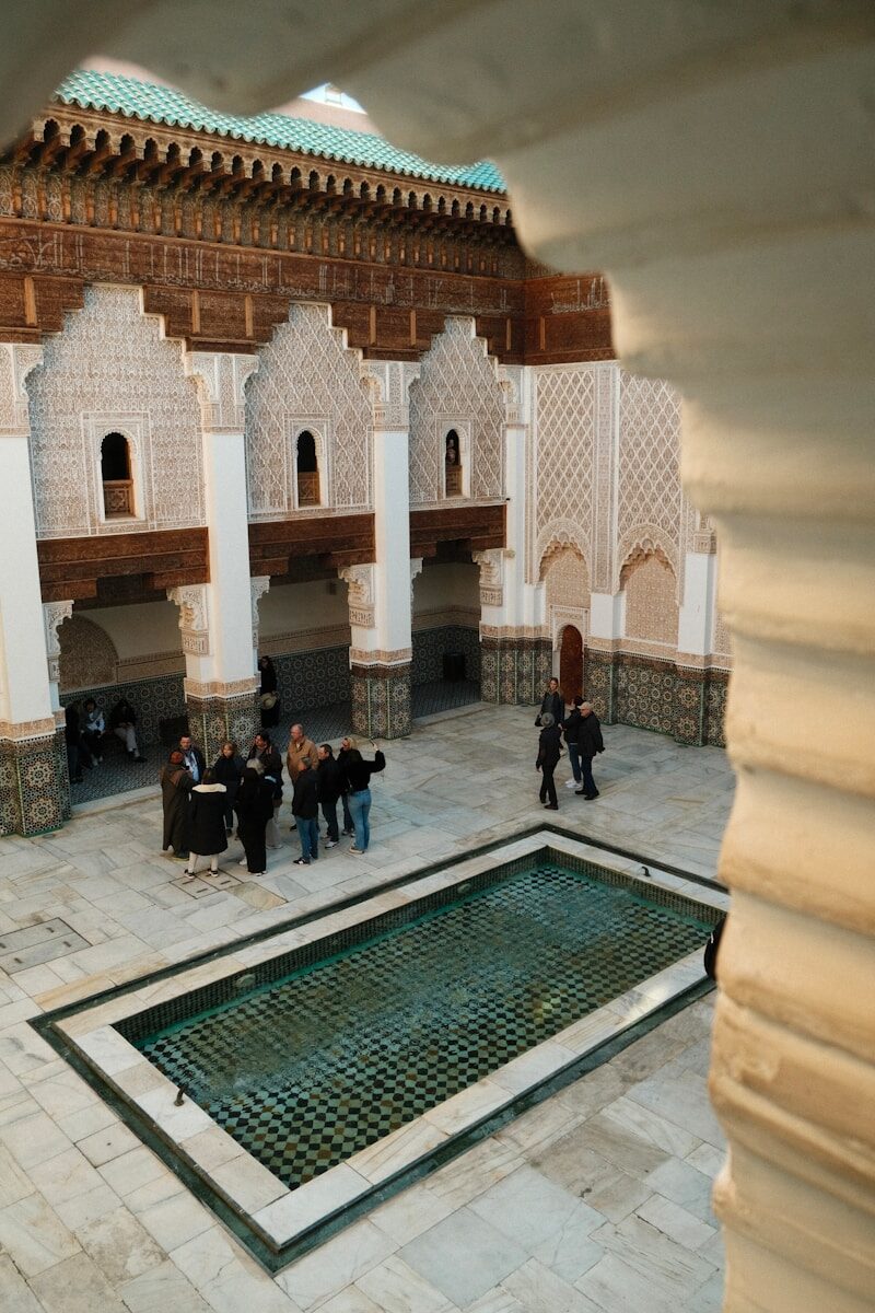 Exhibition Centers in Morocco A group of people standing around a courtyard
