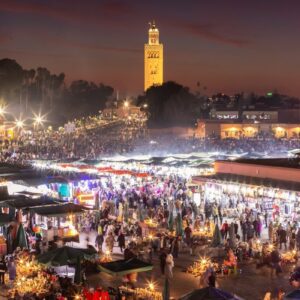 Film Festival Marrakesh A crowd of people standing around a market at night