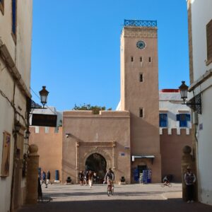 Ancient Libraries of Morocco A moroccan landmark with arches and a clock tower.