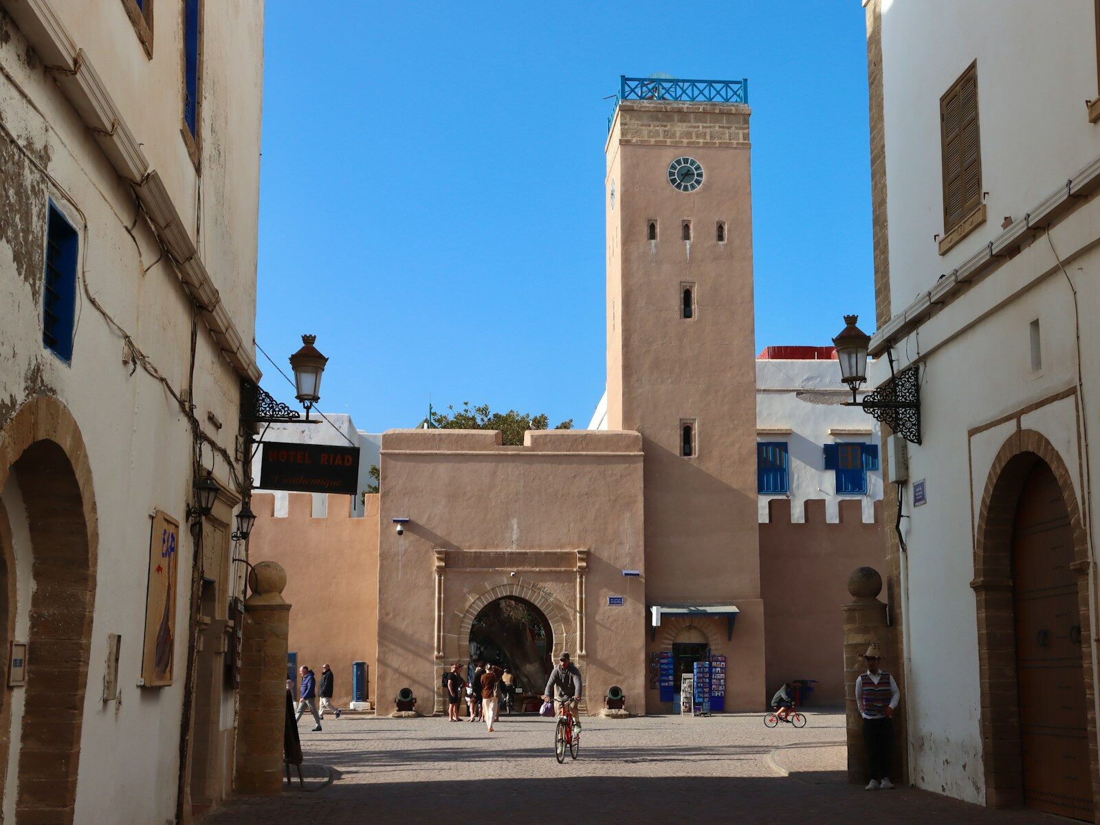 Ancient Libraries of Morocco A moroccan landmark with arches and a clock tower.