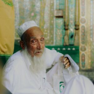 Sufi Culture An elderly muslim man in traditional clothes.