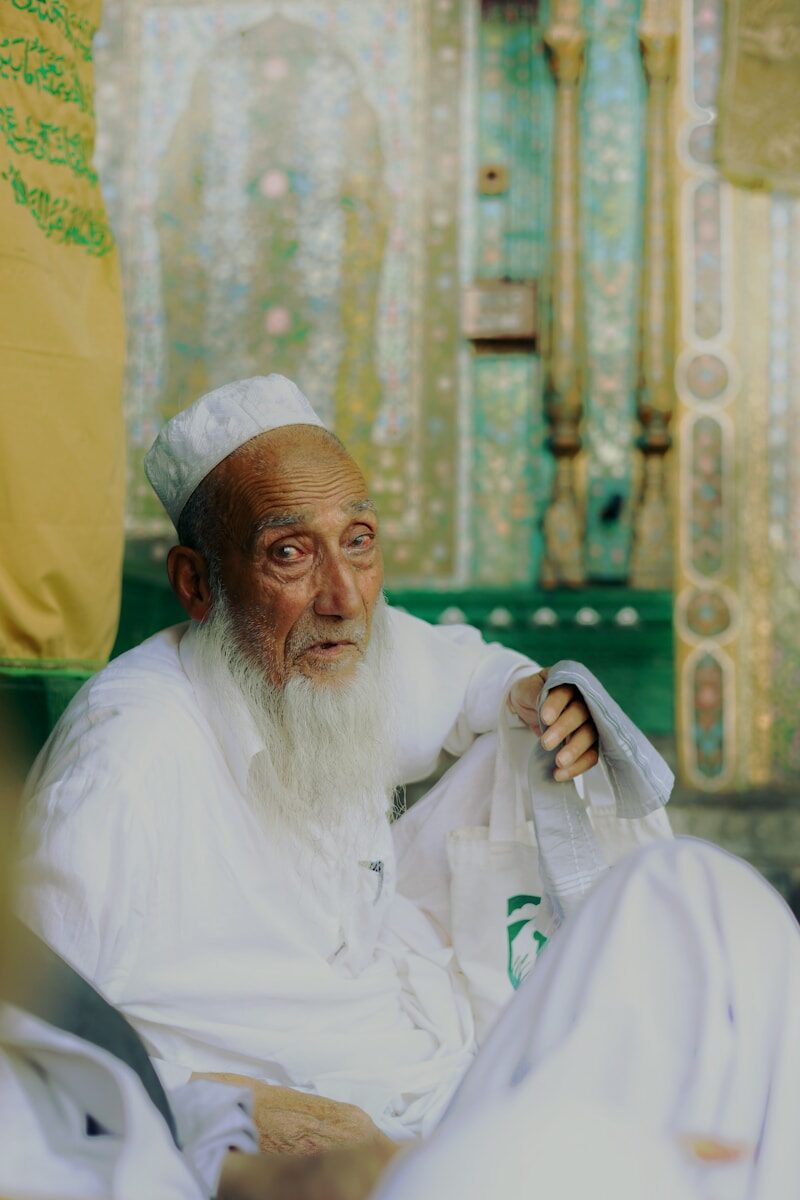 Sufi Culture An elderly muslim man in traditional clothes.
