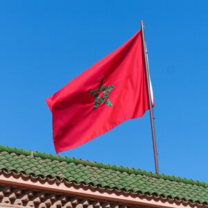 Visa Updates for Morocco A red flag flying on top of a building