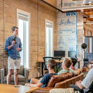 Team Building man standing in front of group of men