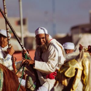 A group of men riding on the backs of horses