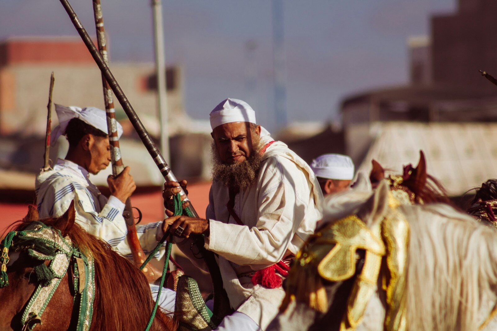 A group of men riding on the backs of horses
