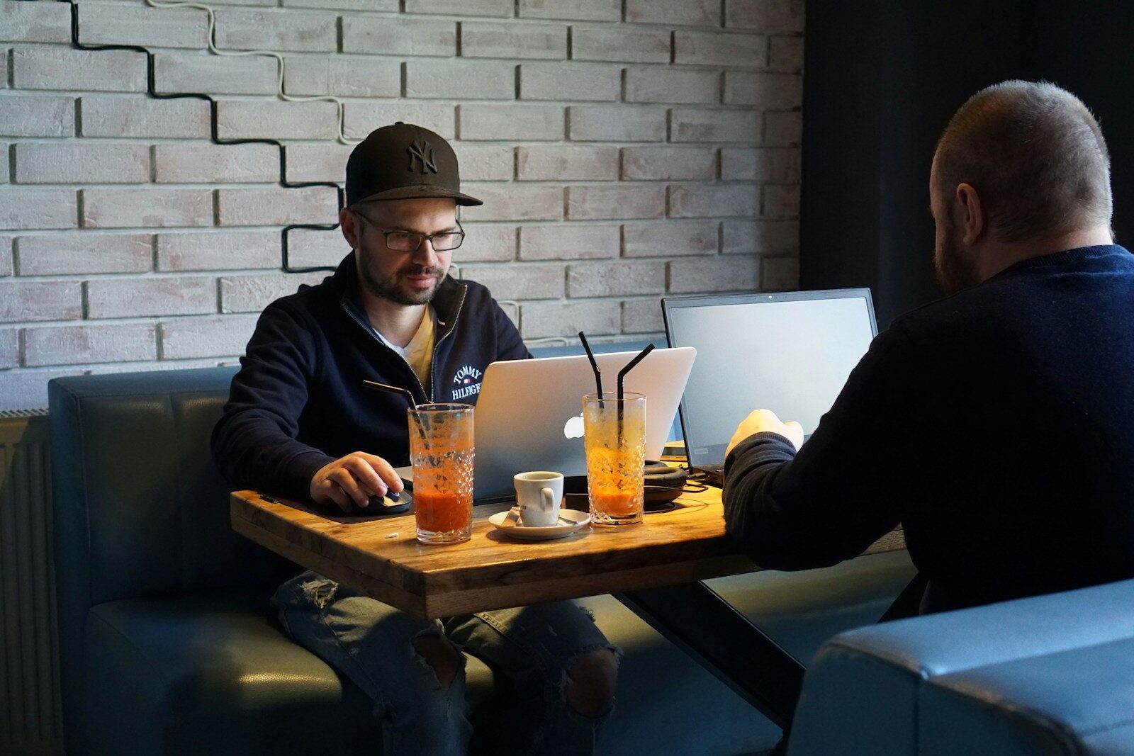 Digital Nomad Life a group of men sitting at a table with drinks