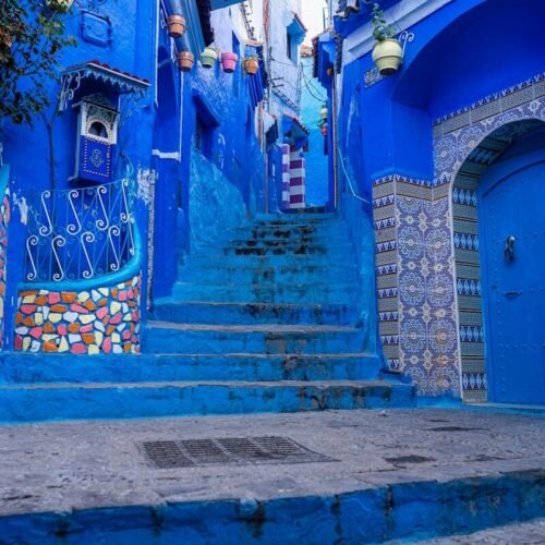 a set of steps leading up to a blue building