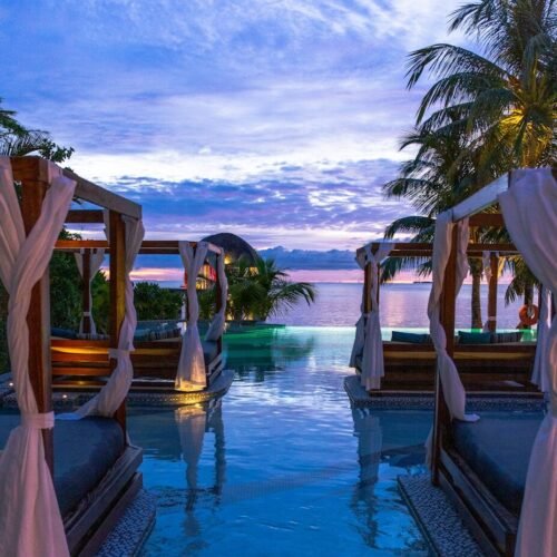 resort viewing blue sea under blue and white sky during daytime