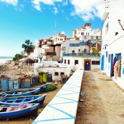 boatd docked near houses and body of water