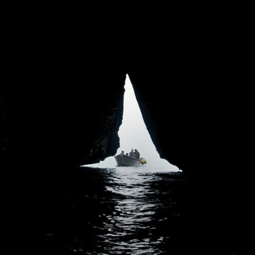 a group of people on a boat in the water