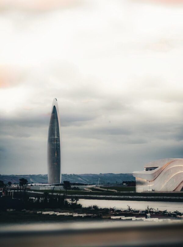 A large building with a very tall tower in the background