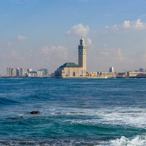 A large body of water with a city in the background