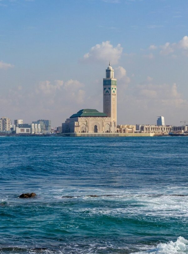 A large body of water with a city in the background