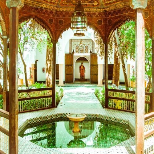 brown wooden gazebo with water fountain
