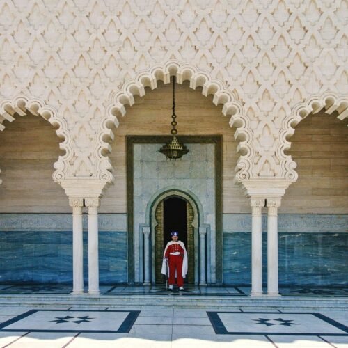 a person standing in a doorway of a building