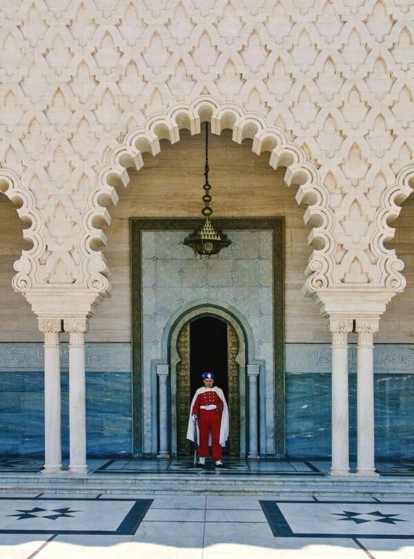 a person standing in a doorway of a building