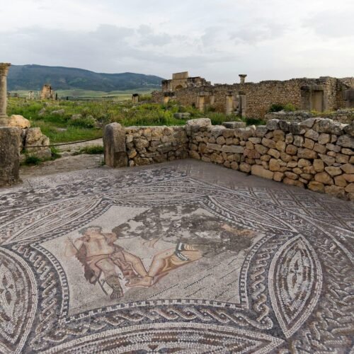 A mosaic in the middle of a stone floor