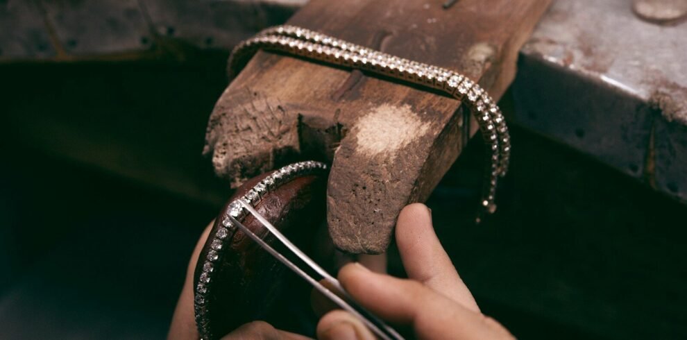person holding brown wooden box