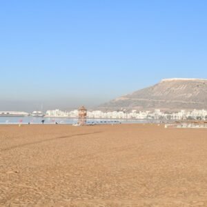 a beach with a mountain in the background