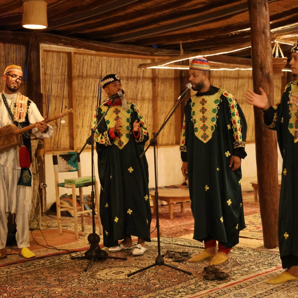 Traditional musicians performing with traditional instruments during a cultural dinner show in Morocco